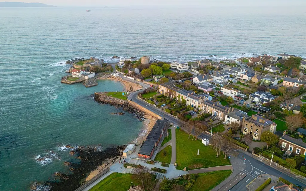 Aerial photo of a picturesque coastal village by the sea at twilight