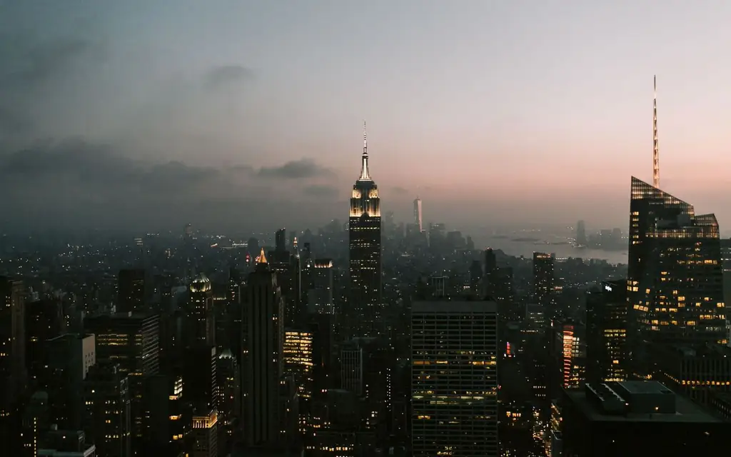 Twilight view of New York City skyline featuring the iconic Empire State Building