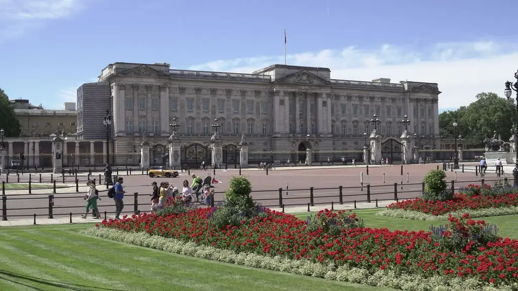 View of Buckingham Palace with lush gardens on a sunny day in London