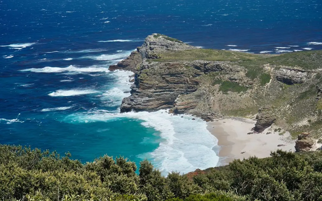 A breathtaking view of Cape Point's rugged coastline and turquoise waters, offering a glimpse into South Africa's natural beauty