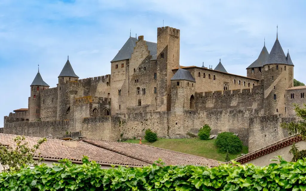Impressive view of Carcassonne Castle in France surrounded by lush greenery