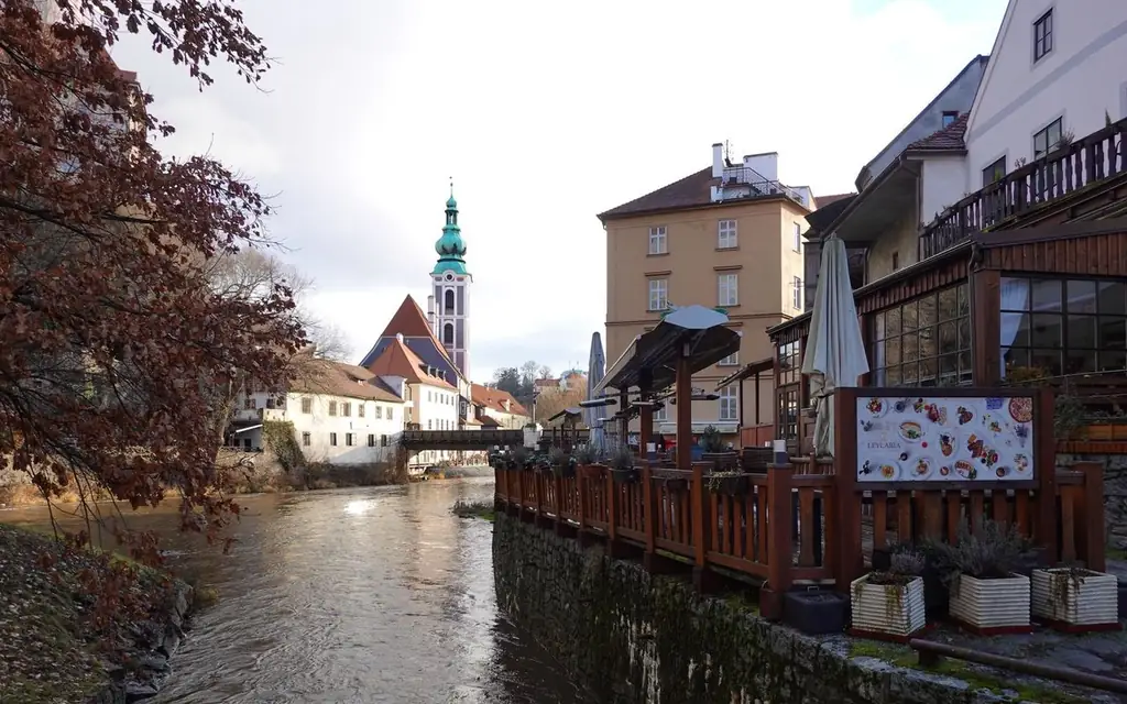 Picturesque scene of Český Krumlov showing St. Jost Church and Vltava River