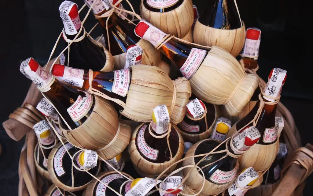 Authentic Tuscan Chianti wine bottles in traditional straw fiasco baskets from Florence, Italy