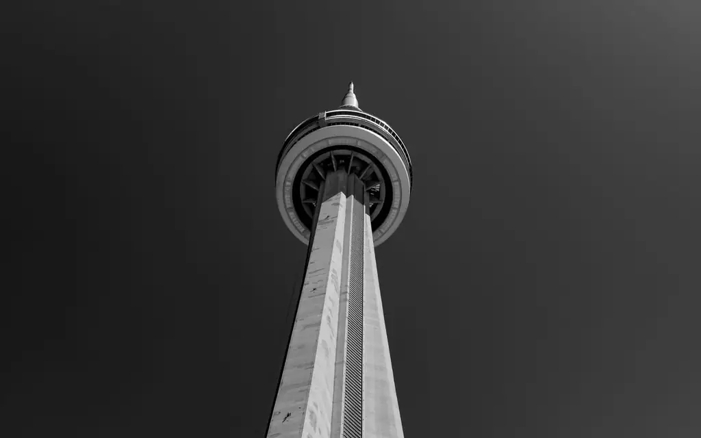 Black and white photo of the CN Tower in Toronto from a unique low angle perspective