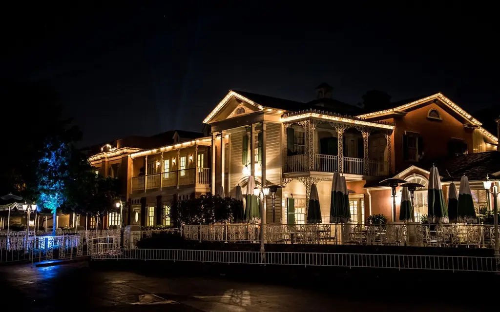 A beautiful illuminated building at night in Anaheim, showcasing intricate exterior design and charming ambiance