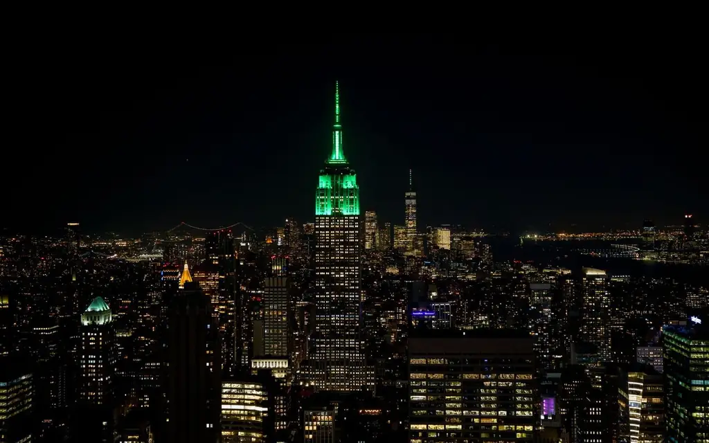Stunning view of New York City's skyline at night with the illuminated Empire State Building