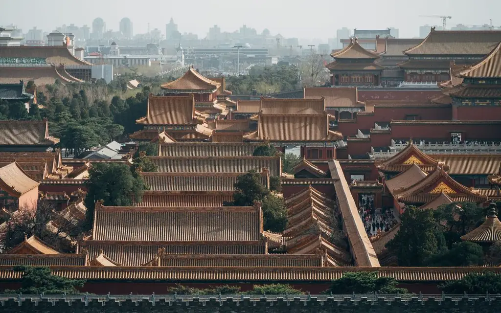 Explore an aerial view of Beijing's Forbidden City showcasing traditional Chinese architecture