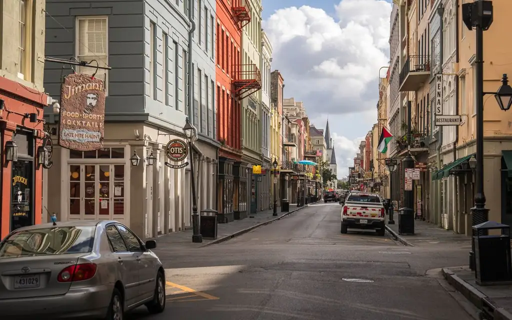 Charming view of colorful buildings and flags in the historic New Orleans French Quarter