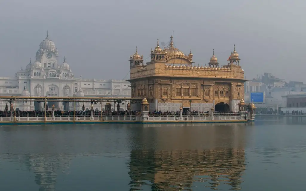 The iconic Golden Temple reflecting in the water at Amritsar, India