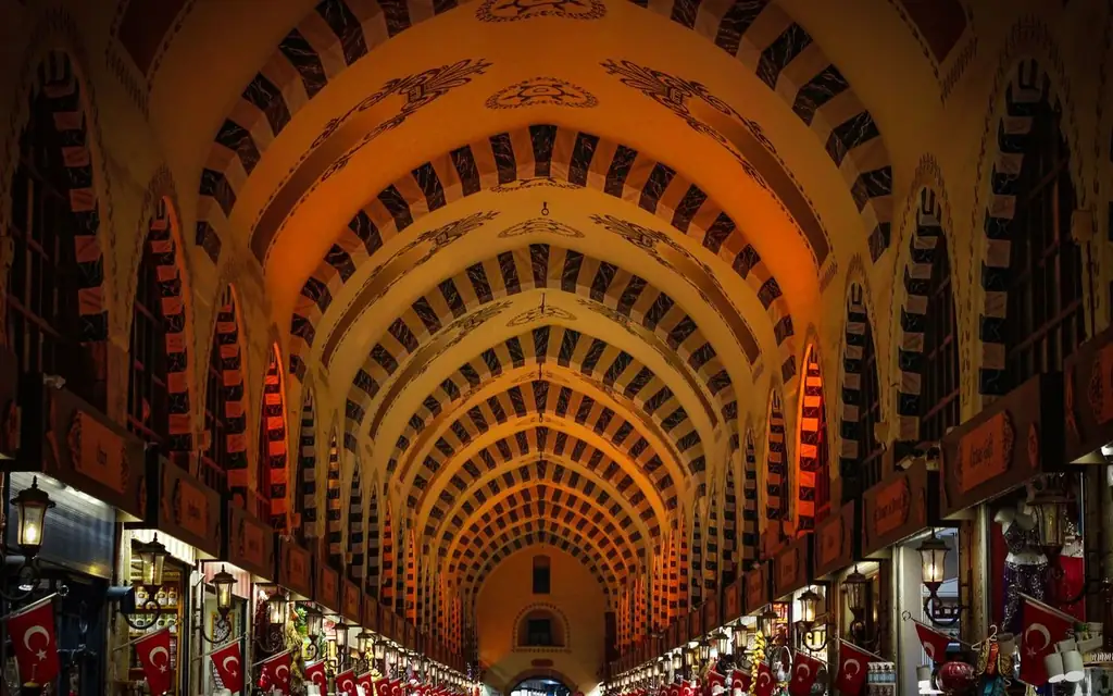 Explore the beautifully illuminated archway interior of Istanbul's famous Grand Bazaar, Türkiye