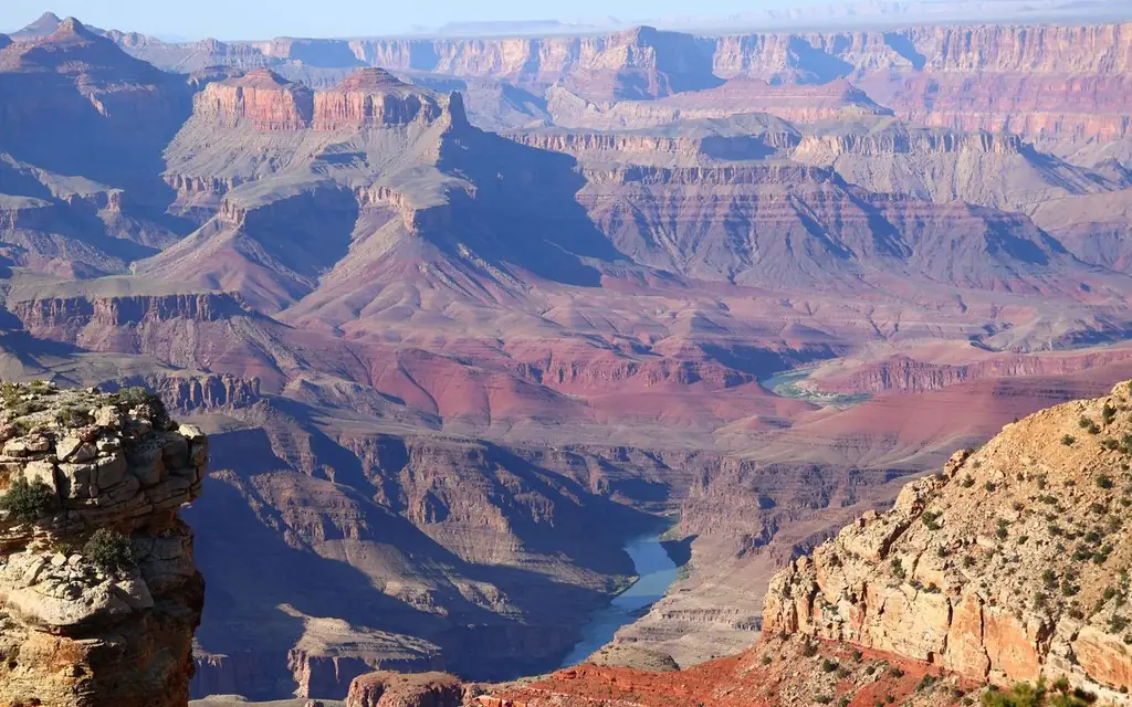 Breathtaking panoramic view of the Grand Canyon, showcasing its vast layers and vibrant colors
