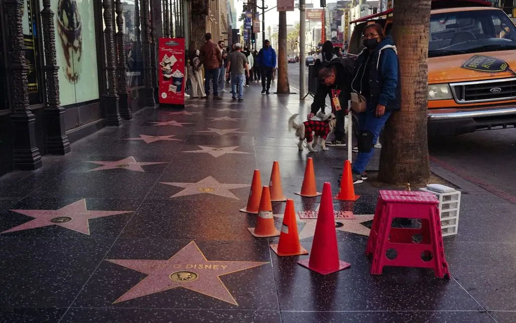 Vibrant day on the Hollywood Walk of Fame with stars and pedestrians