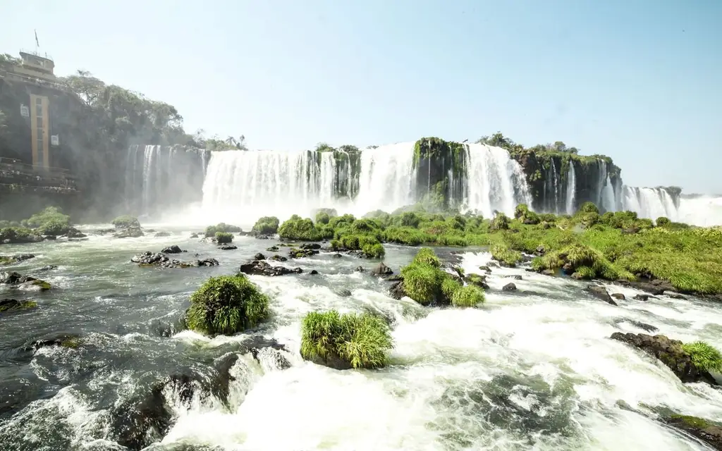 Stunning view of Iguazú Falls, Argentina with lush greenery and cascading water