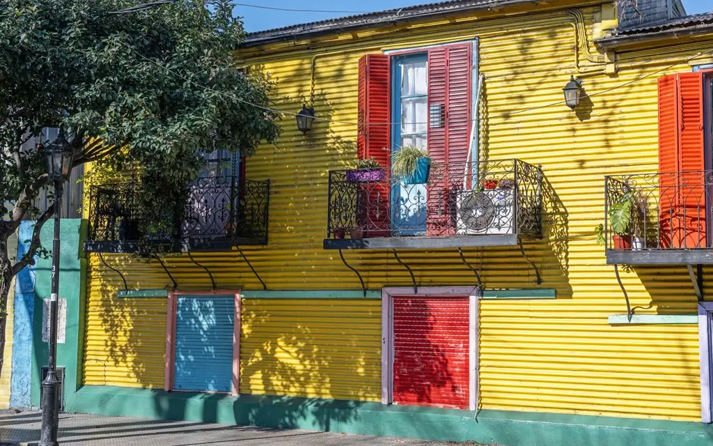 Brightly painted La Boca house with colorful shutters in Buenos Aires, Argentina
