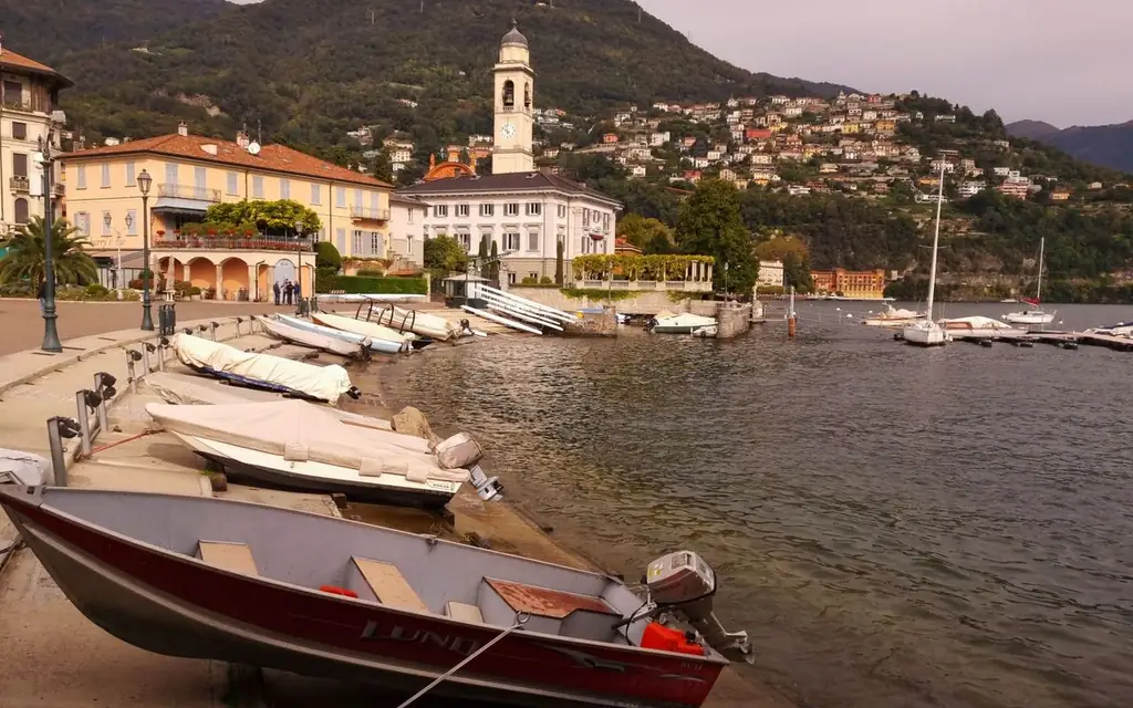 Peaceful harbor scene at Lake Como with boats and scenic hillsides
