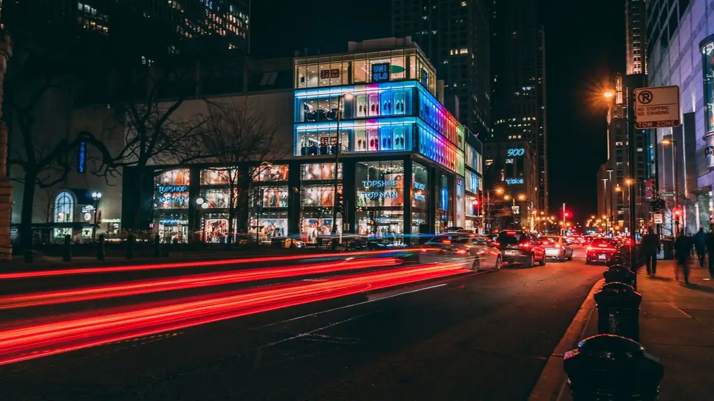 Dynamic Chicago city street at night with light trails and illuminated buildings