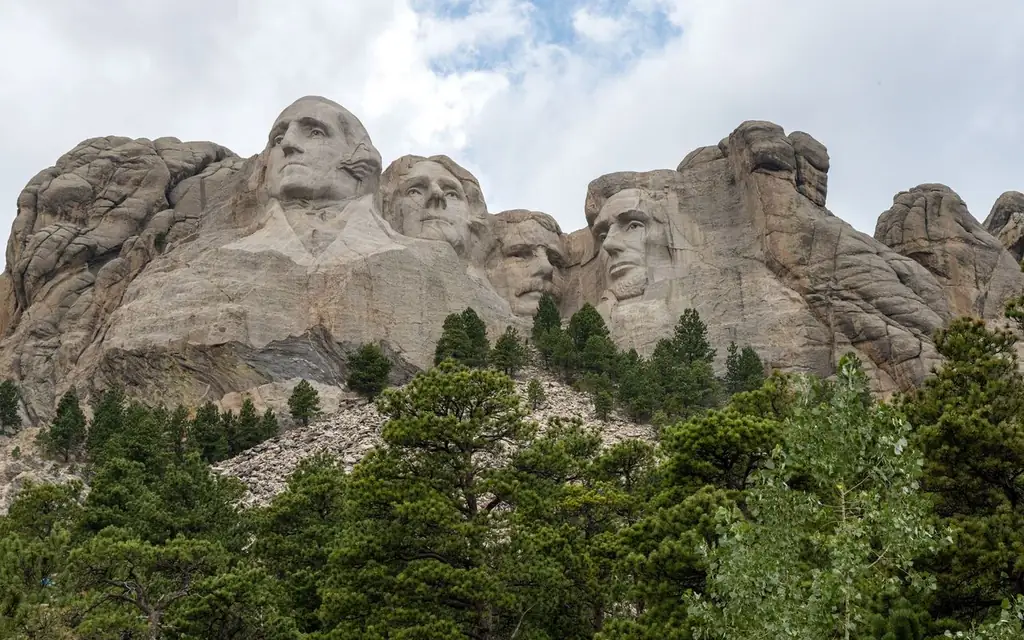 Explore the iconic Mount Rushmore with its monumental sculptures of four American presidents