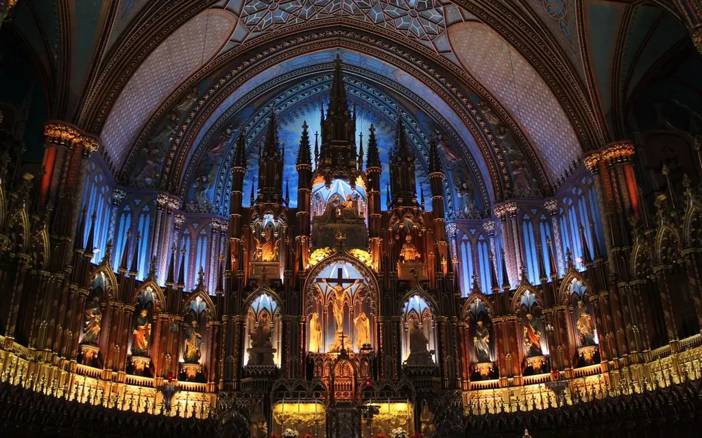 Detailed view of the ornate altar in Notre Dame Basilica, showcasing Gothic architecture indoors