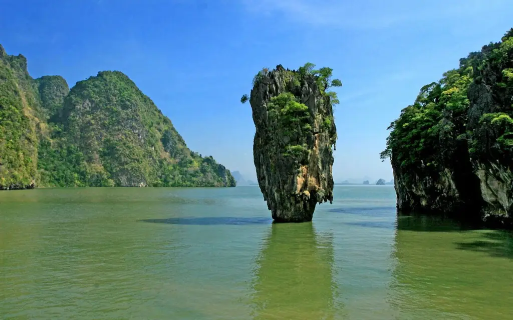 A stunning view of James Bond Island in Thailand's Phang Nga Bay with clear blue skies