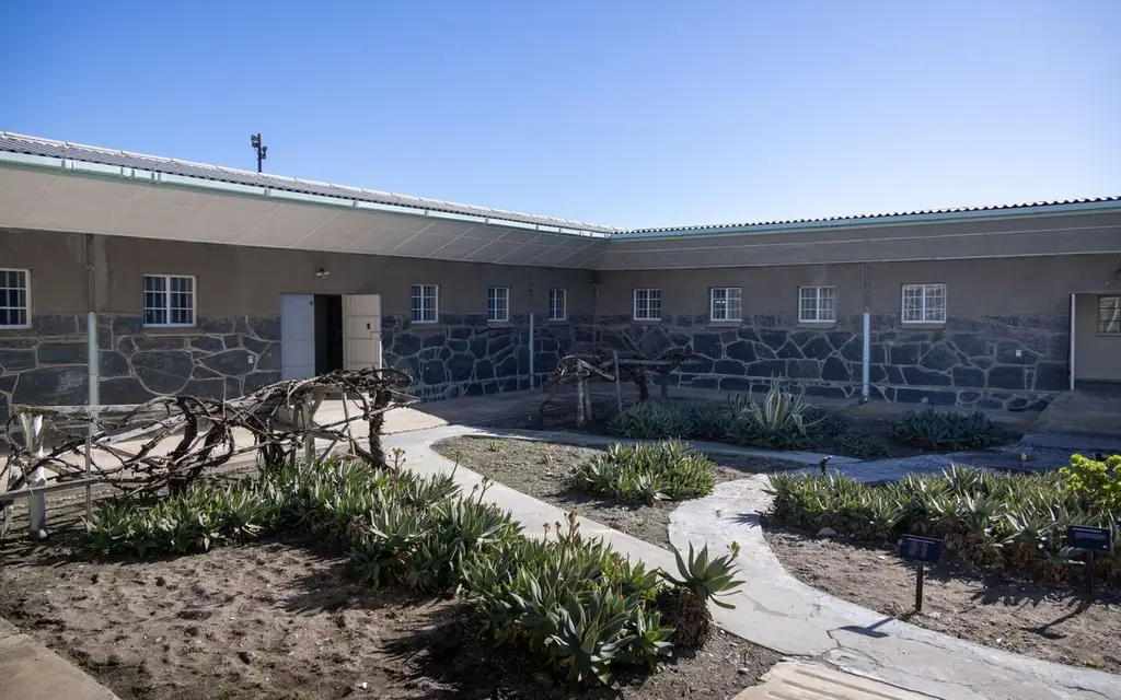 Outdoor courtyard of a prison cell block at Robben Island on a sunny day