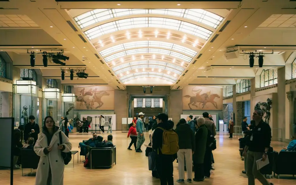 People exploring an art museum exhibit in Toronto, Ontario, Canada