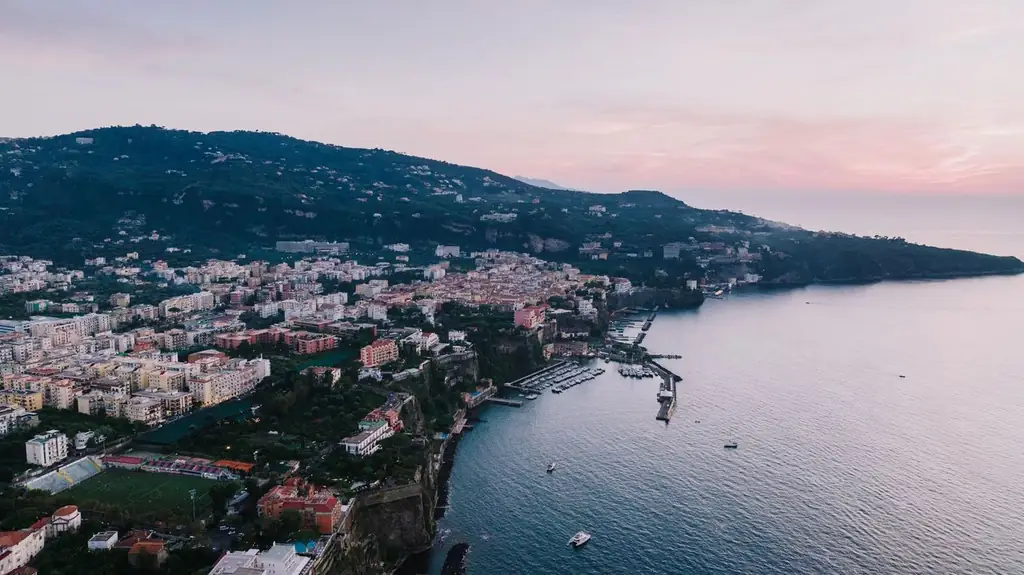 Scenic aerial view of Sorrento, Italy at sunset. A beautiful blend of cityscape and coastline