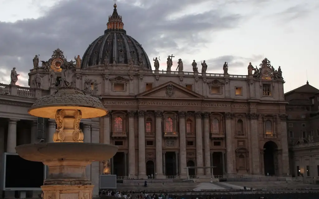 Magnificent view of St. Peter's Basilica at twilight with a fountain in the foreground, Vatican City