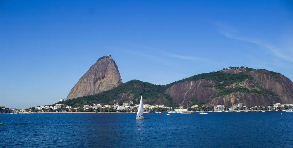 Scenic view of Sugarloaf Mountain with sailboats on a sunny day in Rio de Janeiro, Brazil