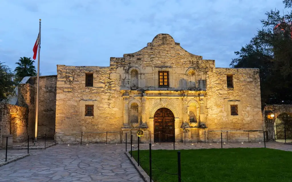 The historic Alamo in San Antonio, Texas, beautifully lit at dusk, showcasing its iconic architecture