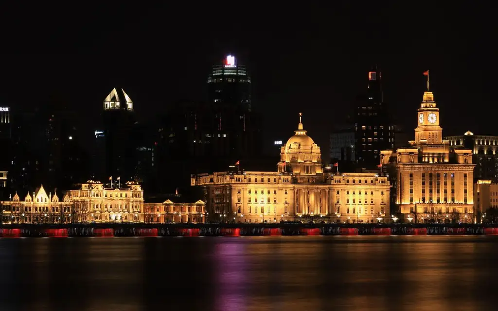 Dramatic night view of Shanghai Bund buildings beautifully illuminated along the Huangpu River