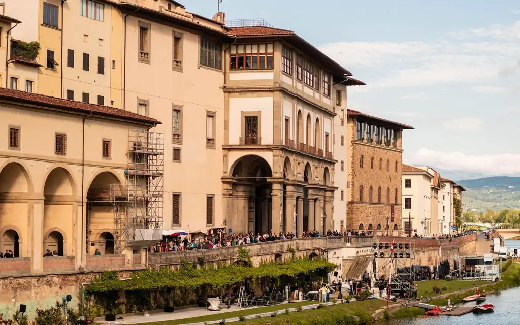 Historic Uffizi Gallery by the Arno River in Florence, showcasing Renaissance architecture