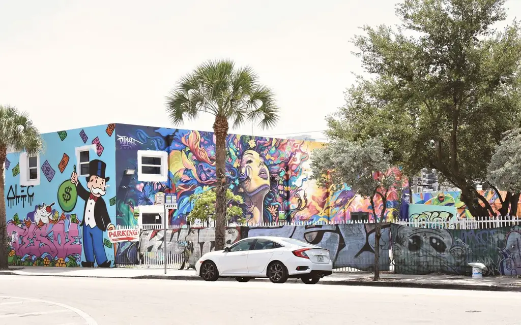 Colorful street art in Miami's urban environment featuring vivid graffiti and mural artwork