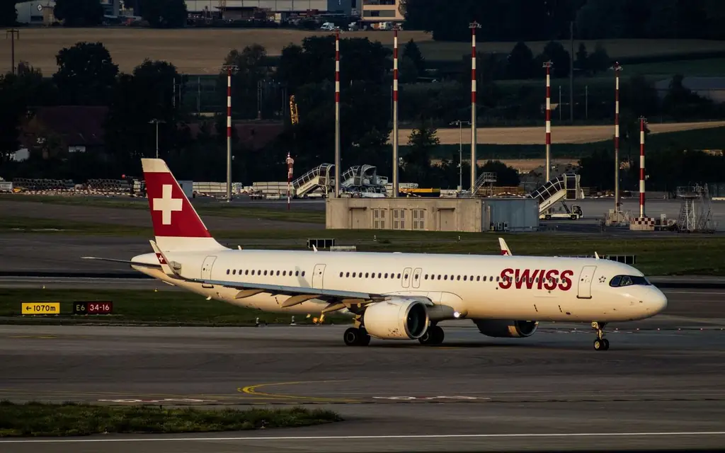 Swiss airplane taxiing on the tarmac at Zurich Airport during the day