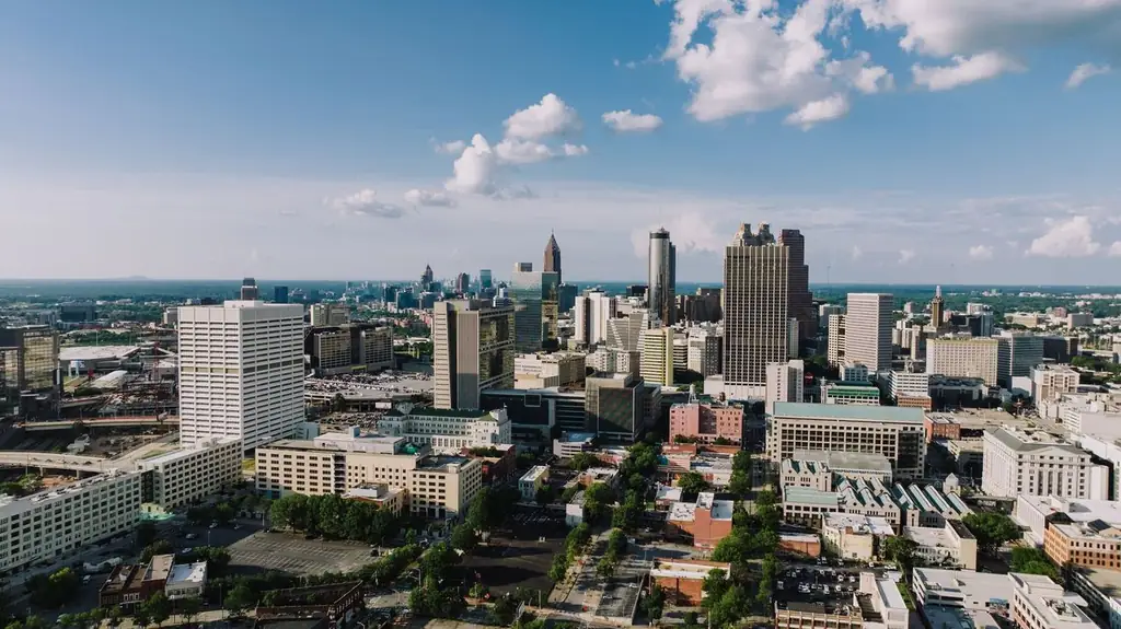 Stunning aerial view of Atlanta's modern skyline under a clear blue sky