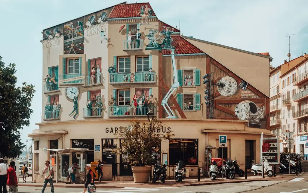 Colorful murals adorn a building in Cannes, capturing artistic urban scenery