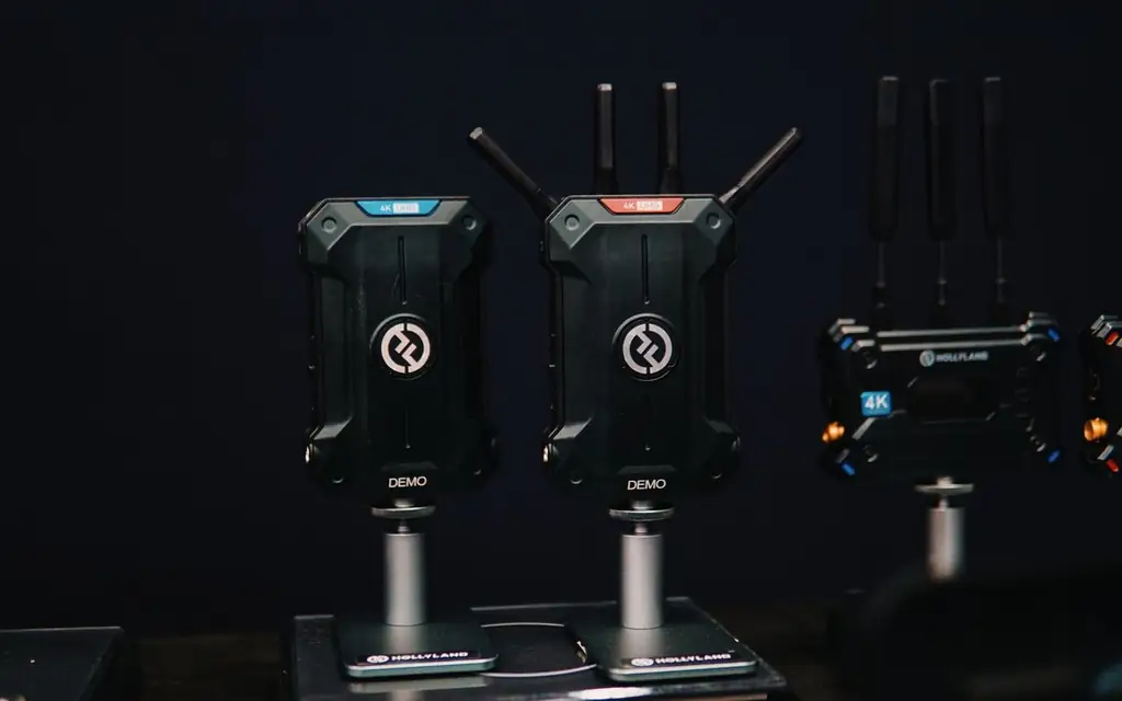 Close-up of wireless video transmitters and receivers on display, showcasing sleek technology design