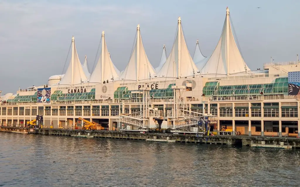 A view of the iconic Canada Place in Vancouver, featuring its unique sail-shaped architecture by the waterfront