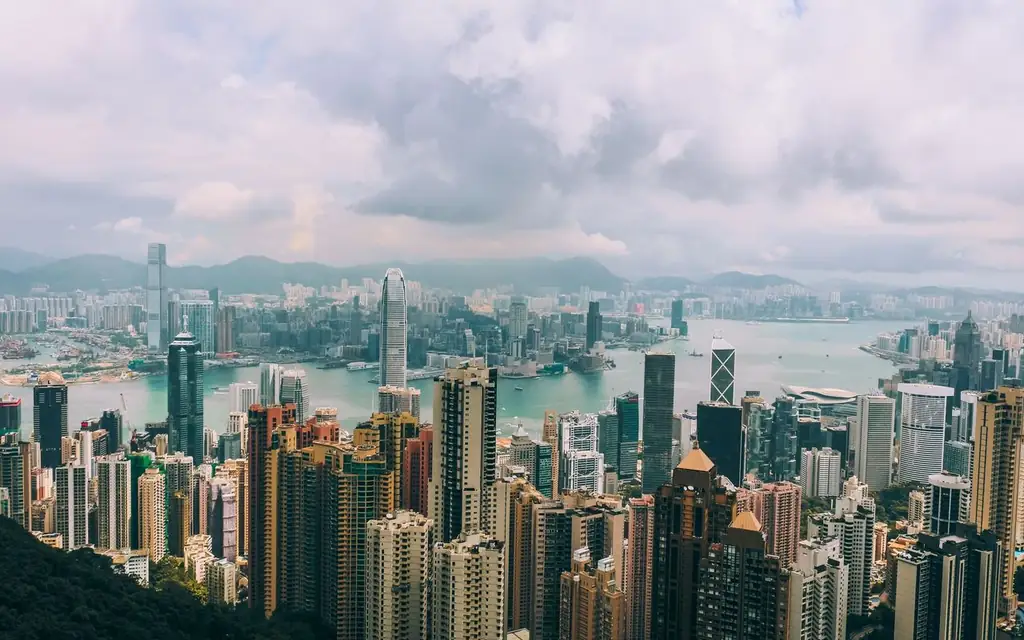 Panoramic view of Hong Kong skyline with skyscrapers and Victoria Harbour from Victoria Peak