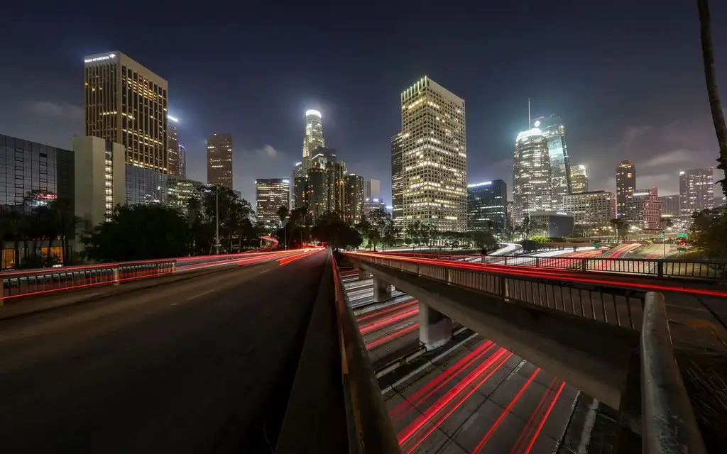 Stunning long exposure of Los Angeles downtown skyline at night with light trails