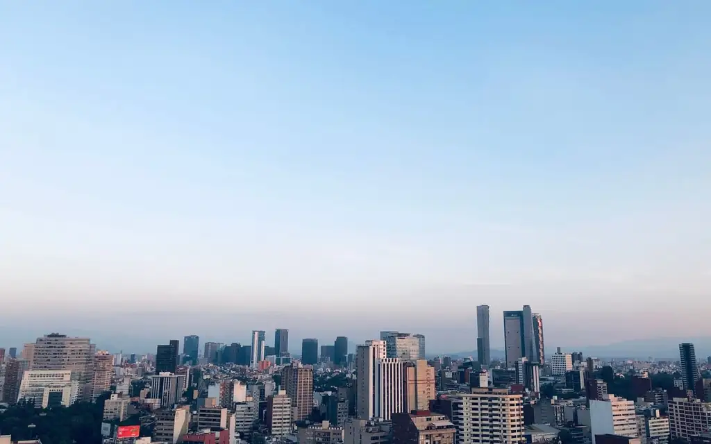 Beautiful aerial view of Mexico City's skyline with skyscrapers under a clear blue sky