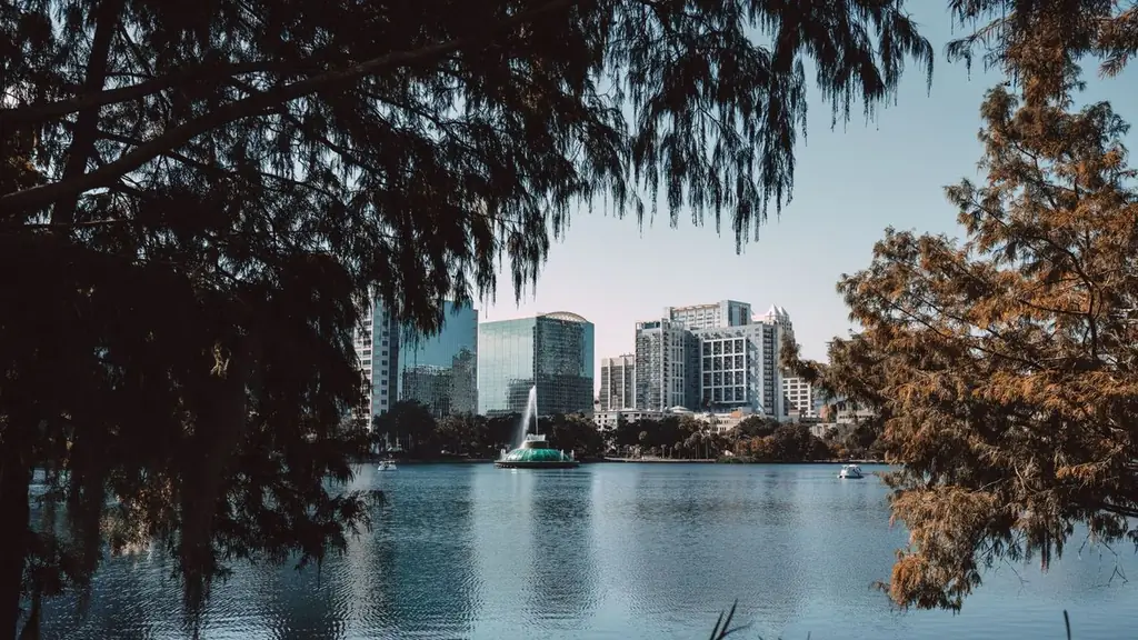 Captivating view of downtown Orlando skyline framed by trees at Lake Eola