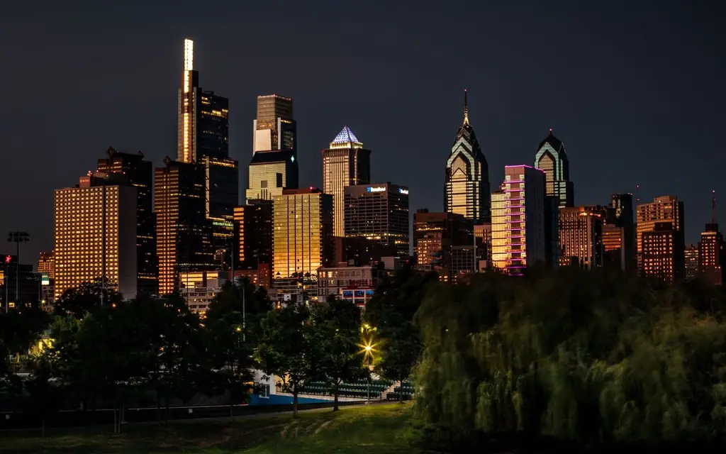Stunning view of Philadelphia's skyline illuminated at night, showcasing iconic skyscrapers and urban beauty