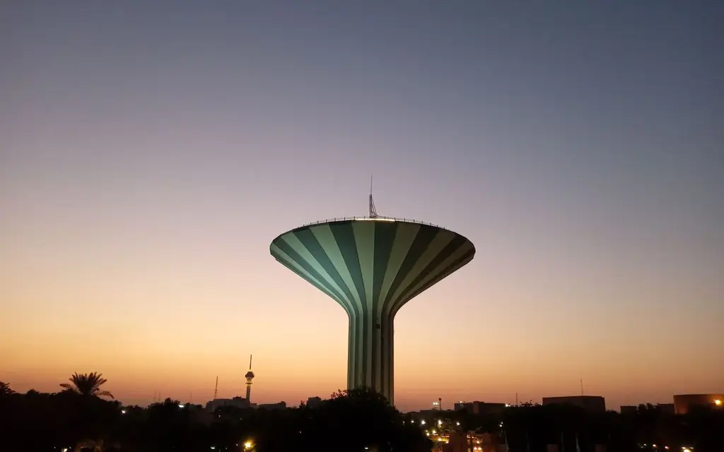 Beautiful view of Riyadh Water Tower silhouetted against a stunning sunset sky