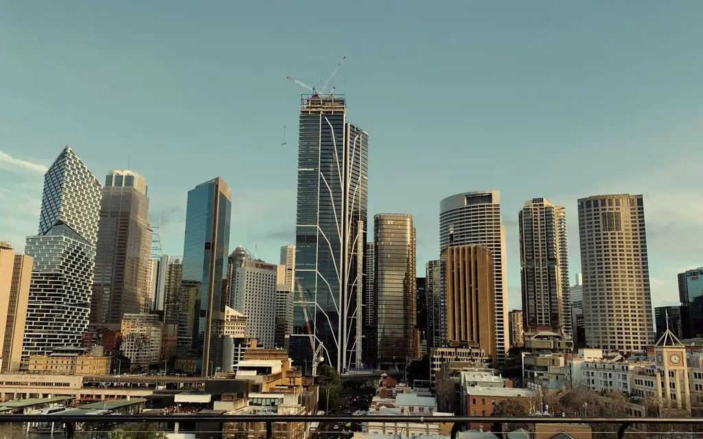A stunning view of Sydney's skyline featuring modern skyscrapers and iconic architecture under a blue sky