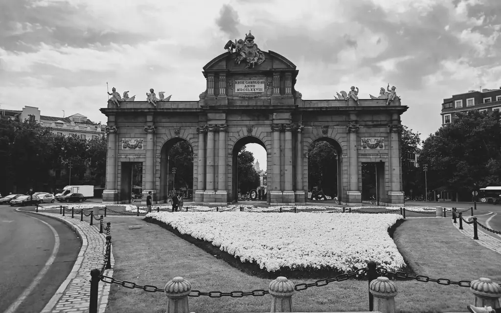 Monochrome image of the iconic Puerta de Alcalá archway in Madrid, Spain